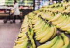 3 Ways to save money on food - picture of bananas in grocery aisle