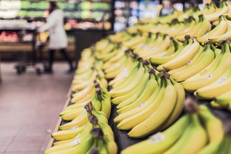 3 Ways to save money on food - picture of bananas in grocery aisle