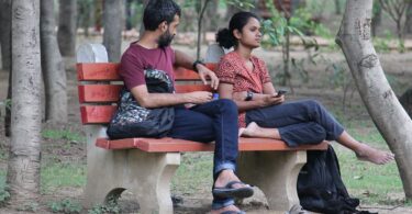 Couple on a park bench. "Learning How to Fight Fair"