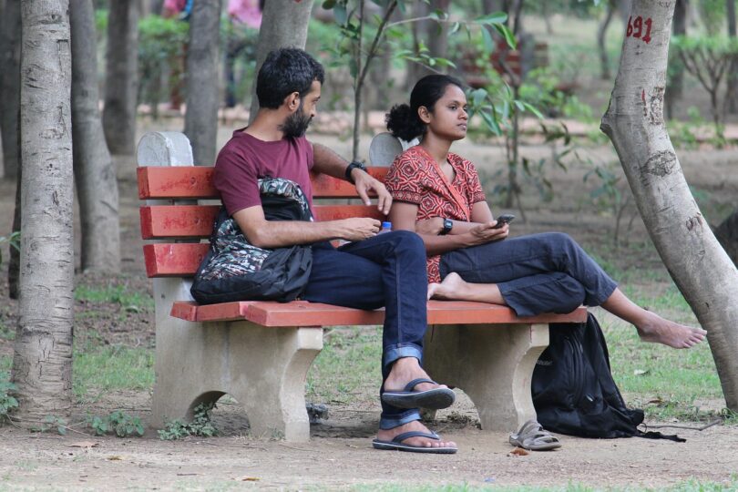 Couple on a park bench. "Learning How to Fight Fair"